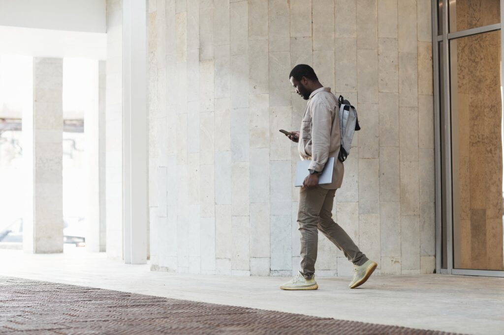 African American Businessman Leaving Office Building