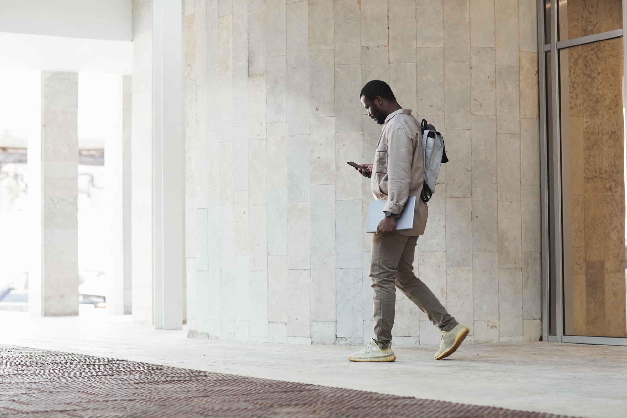 African American Businessman Leaving Office Building